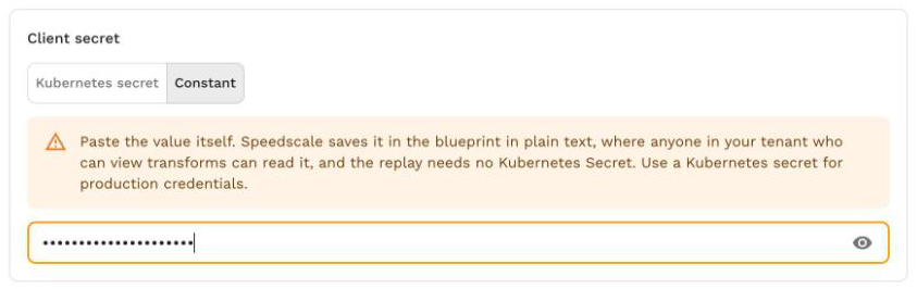 A client secret saved as a constant, with the plain-text warning and a masked field